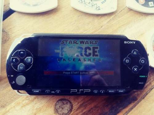 PSP 1000 ( Fair condition) with 8 games
