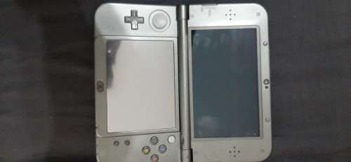 New Nintendo 3D XL ( has a small craxk on the right upper screen corner)