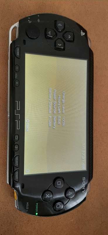 PSP Black console ( works 100% has a dirt speck in the screen)