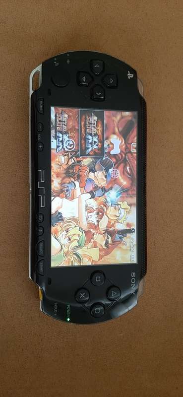 PSP Black console ( works 100% has a dirt speck in the screen)