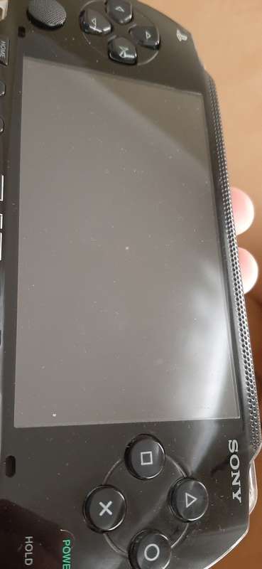 PSP Black console ( works 100% has a dirt speck in the screen)
