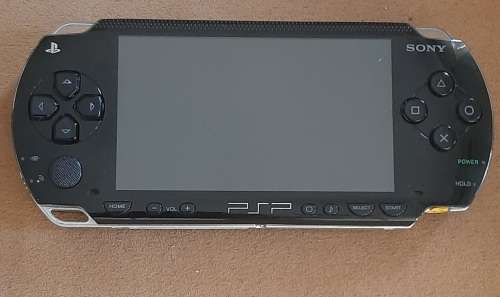 PSP 1001 ( Very Good condition) + 4 games