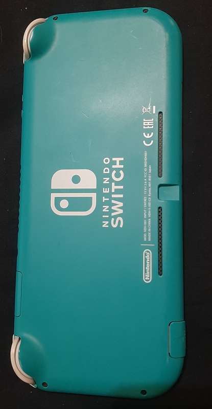 Nintendo Switch Lite ( Has a crack in the bottom housing) works 100%