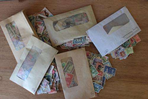 Colonial Britain - lots of countries used with some mint stamps. Five envelopes full.