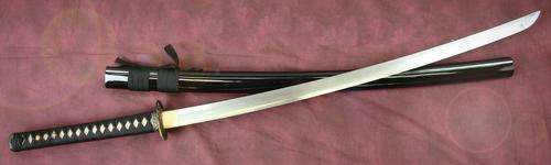 Lovely Folded Steel Turbulant Wave katana - 6000 layered blade with a real clay tempered blade .