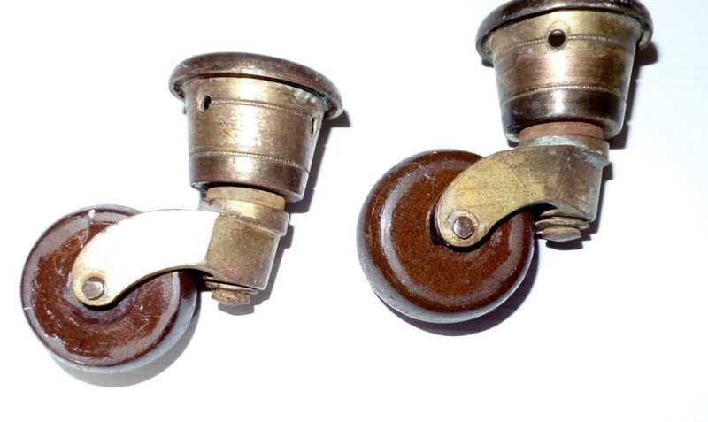 ANTIQUE VICTORIAN CERAMIC AND BRASS CUP CASTORS