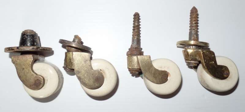 ANTIQUE VICTORIAN BRASS AND CERAMIC CASTORS X 4