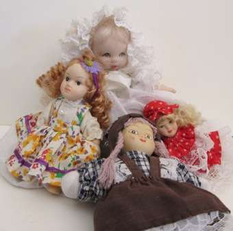 Four Small Porcelain Dolls