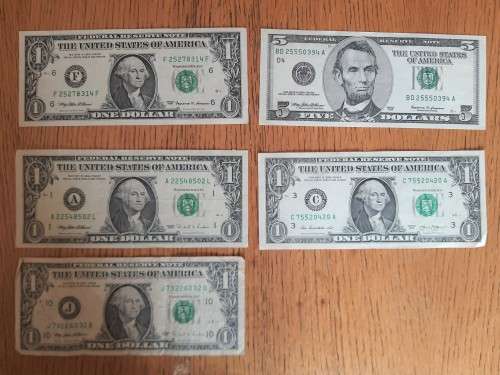 4x 1 Dollar Notes and 1x 5 Dollar Note
