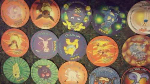A huge lot of pokemon Tazos PLUS LEGENDARY POKEMONS
