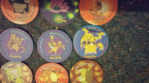 A huge lot of pokemon Tazos PLUS LEGENDARY POKEMONS