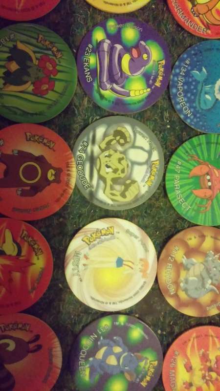 A huge lot of pokemon Tazos PLUS LEGENDARY POKEMONS