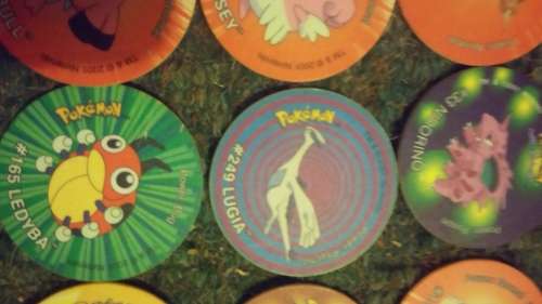 A huge lot of pokemon Tazos PLUS LEGENDARY POKEMONS