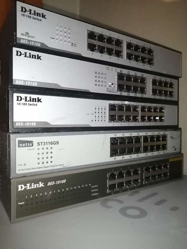 Lot of 14 switches & routers new & used, 7x Netgear Extenders, 1x Netgear AC1200, 5x Dlink switch,