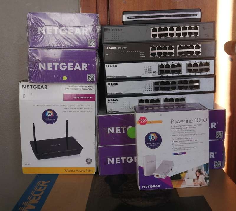 Lot of 14 switches & routers new & used, 7x Netgear Extenders, 1x Netgear AC1200, 5x Dlink switch,