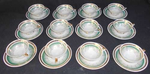 Vintage German Porcelain. 12 demitasse duo's on paw feet........gorgeous!!!!