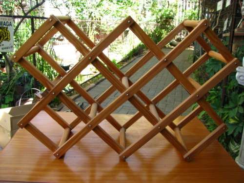 A VINTAGE EXPANDABLE WOOD WINE RACK...HOLDS 10 BOTTLES