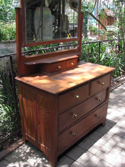 A VINTAGE TEAK DRESSING TABLE