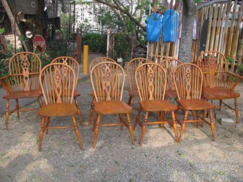 A SET OF 10 VINTAGE OAK WINDSOR WHEELBACK CHAIRS...2 CARVERS AND 8 CHAIRS