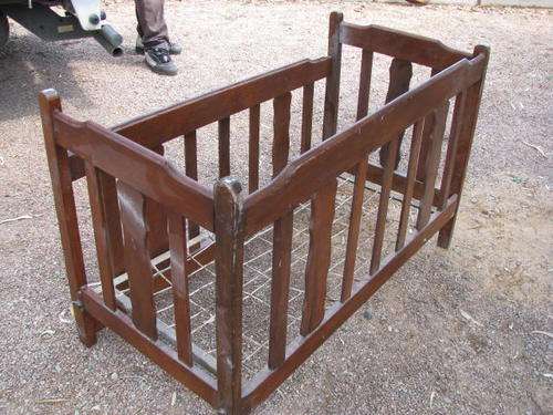 A VINTAGE COT. WHY NOT TURN THIS INTO A CHILDS COUCH WITH SOME COMFY CUSHIONS..CUT THE ONE SIDE OFF!