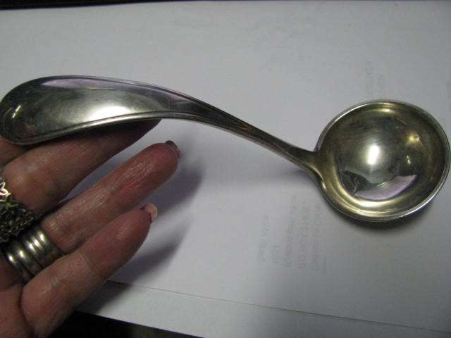 A DUTCH HALLMARKED SILVER GRAVY LADLE... COULD ALSO BE USED TO SERVE CREAM