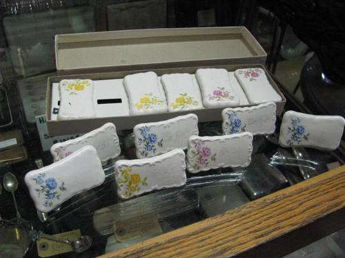SET OF 12 PORCELAIN PLACE SETTINGS FOR YOUR GUESTS NAME TO BE WRITTEN ONTO.. NAME CAN BE RUBBED OFF