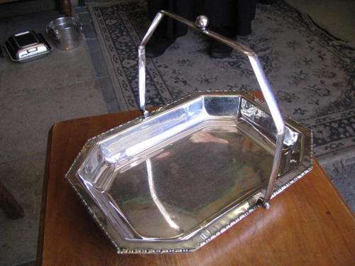 A LOVELY SNACK DISH.WITH HANDLE.......DETAILED EDGING