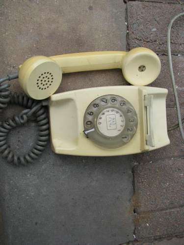 AN OLD TELEPHONE............ WITH ROUND DIAL