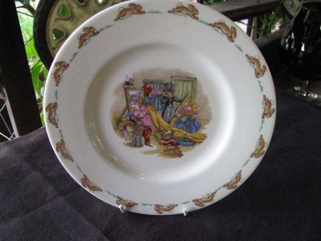 A VINTAGE ROYAL DOULTON BUNNYKINS PLATE..............TRYING ON CLOTHES