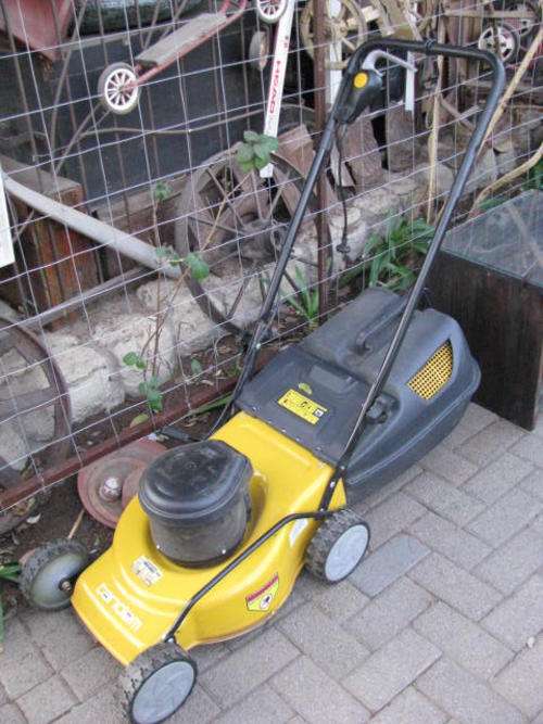A TANDEM TOWNHOUSE ELECTRIC LAWNMOWER........ USED A FEW TIMES !!!!!!!!!!