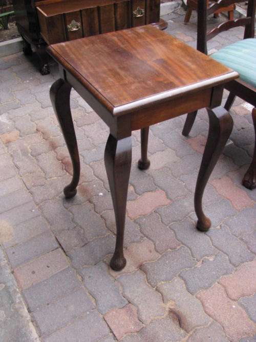 A 1930'S-40'S SOLID IMBUIA LINEN FOLD PAD FOOT SIDE TABLE