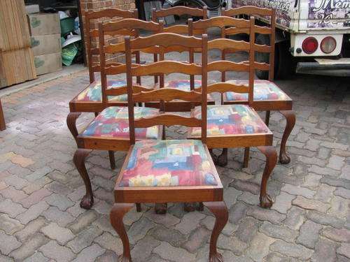 A SET OF 6 IMBUIA BALL AND CLAW LADDER BACK CHAIRS....IN GOOD CONDITION