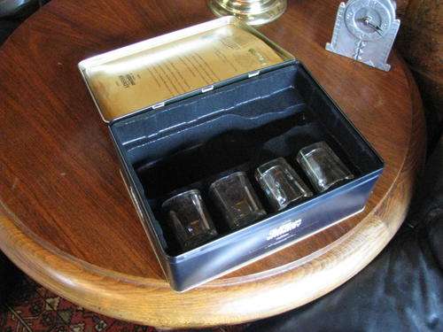 (NUMBER 2)A JACK DANIELS LARGE SQUARE TIN WITH HINGED LID...CONTAINS 4 GLASSES