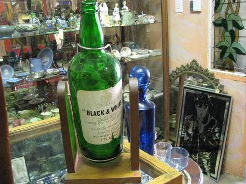 &@$ HUGE "BLACK AND WHITE" WHISKEY BOTTLE ON STAND  &@$