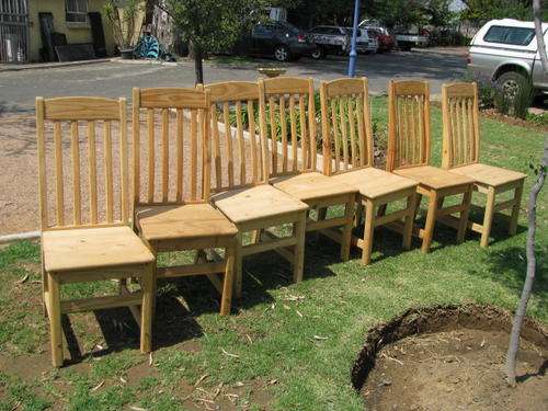 A HIGHBACK SLATTED CHAIR... THERE ARE 7 AVAILABLE... BID IS PER EACH
