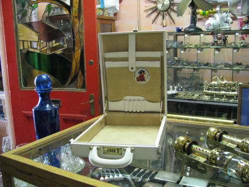 AN OLD ATTACHE CASE IN WHITE