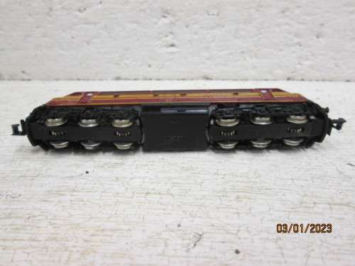 N SCALE : TRIX : MAROON WITH YELLOW STRIPES DIESEL LOCOMOTIVE
