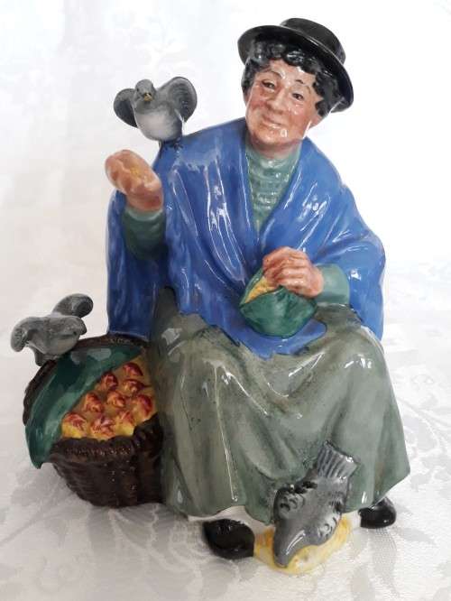 A ROYAL DOULTON TUPPENCE A BAG FIGURINE.