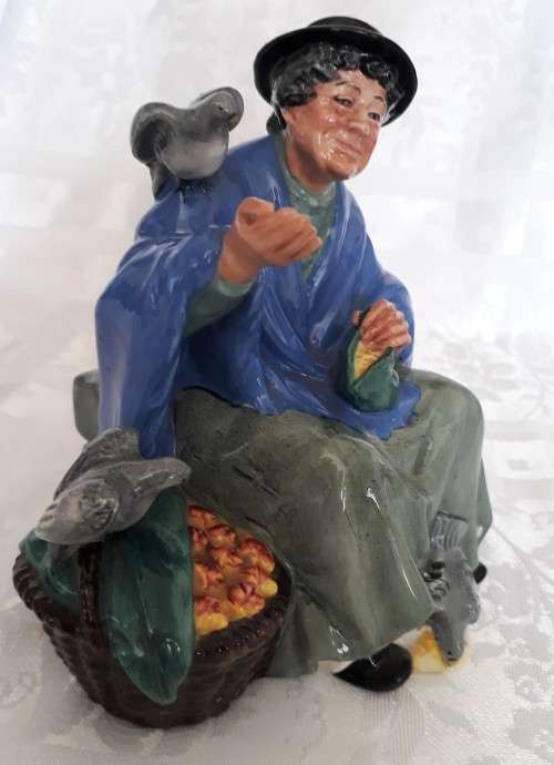 A ROYAL DOULTON TUPPENCE A BAG FIGURINE.