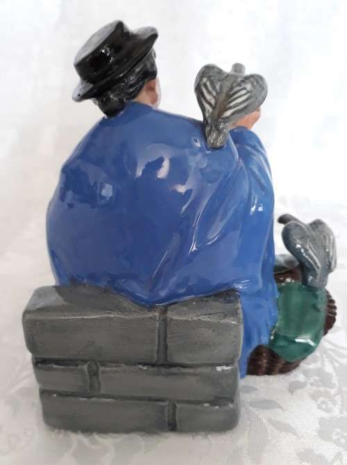 A ROYAL DOULTON TUPPENCE A BAG FIGURINE.