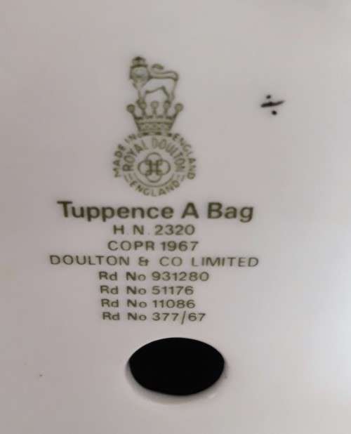 A ROYAL DOULTON TUPPENCE A BAG FIGURINE.
