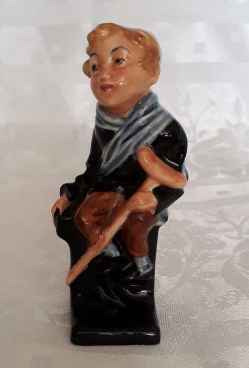 A DOULTON TINY TIM FIGURINE