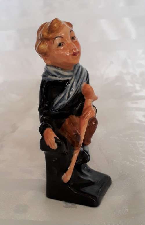 A DOULTON TINY TIM FIGURINE
