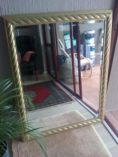 large gold framed mirror