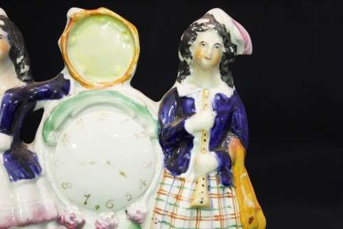 Pair of ladies and a clock