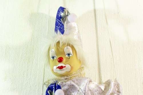 Clown on a swing - Silver and blue costume
