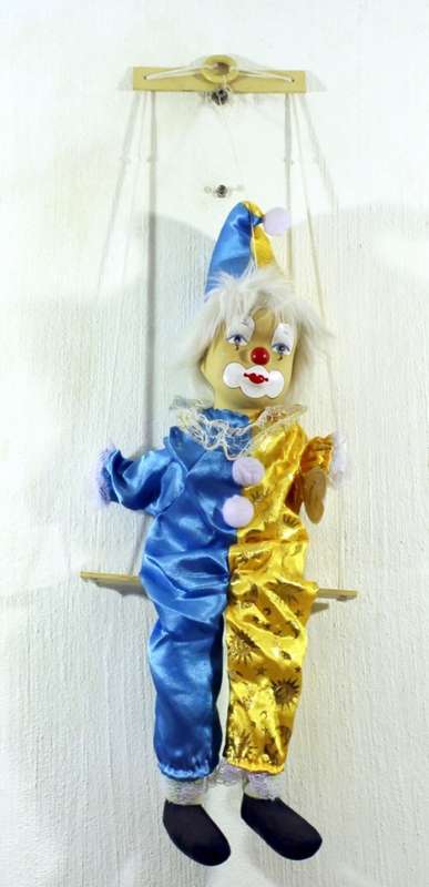 Clown on a swing - Gold and blue costume