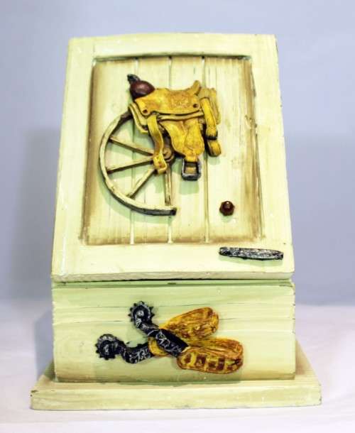 Small storage cabinet - saddle embellishment