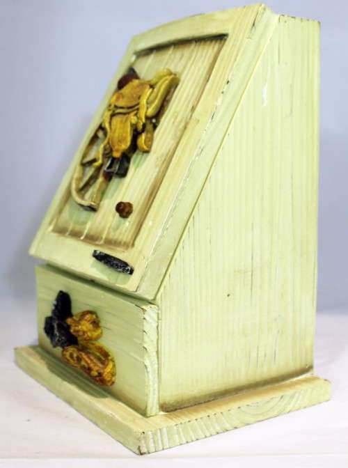 Small storage cabinet - saddle embellishment