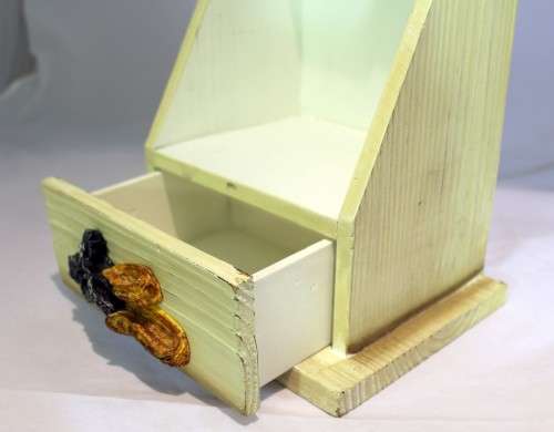 Small storage cabinet - saddle embellishment